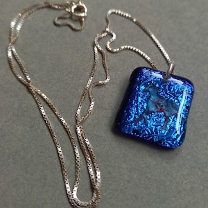 Blue glass horse pendant necklace on Sterling silver chain