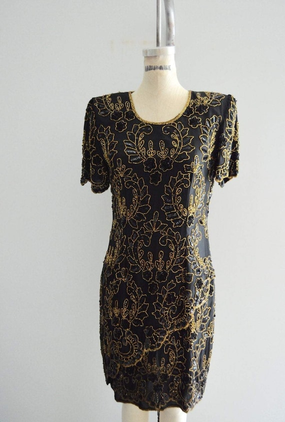 boho chic cocktail dresses Black Dress This stunning maxi dress features fringed lace tiers that add a touch of bohemian charm to its staple silhouette Adventurer Like You Maxi M