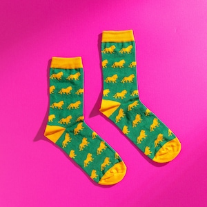 Green and yellow lion pattern socks. Safari pattern socks