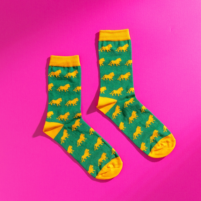 Green and yellow lion pattern socks. Safari pattern socks