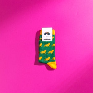 Green and yellow lion pattern socks. Safari pattern socks