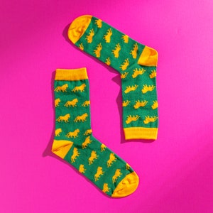 Green and yellow lion pattern socks. Safari pattern socks