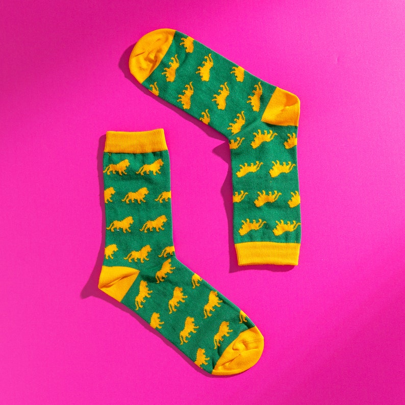 Green and yellow lion pattern socks. Safari pattern socks