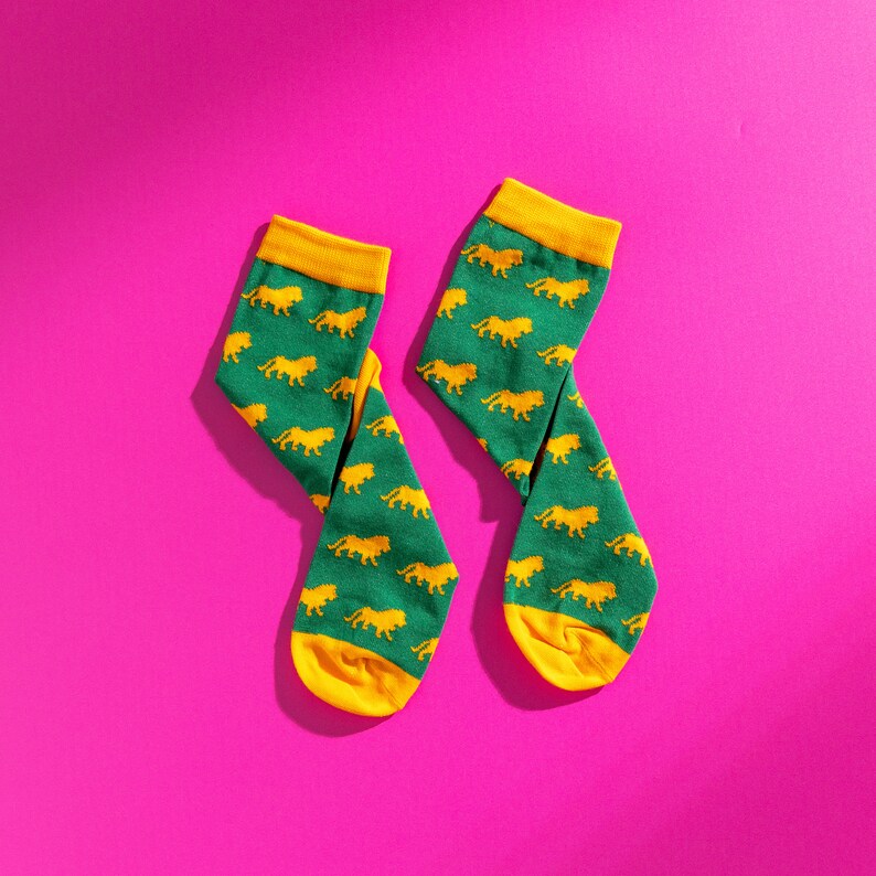 Green and yellow lion pattern socks. Safari pattern socks