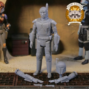 May include: A grey action figure of a character from a science fiction franchise, standing with detached accessories. The figure is in a standing pose, with a helmet and two arm pieces lying on the ground. The Angry Raccoon Miniatures logo is visible.