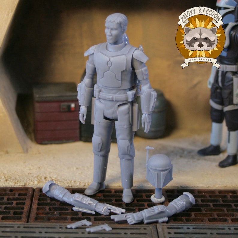 May include: A gray action figure of a character in armor, with a helmet and detached arms and weapons. The figure is standing on a surface with a metal grate. The Angry Raccoon Miniatures logo is in the upper right corner.