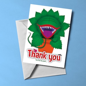 Little Shop Of Horrors - Biglietto di auguri a tema Audrey II (vuoto all'interno) / Biglietto a tema musicale / Include busta