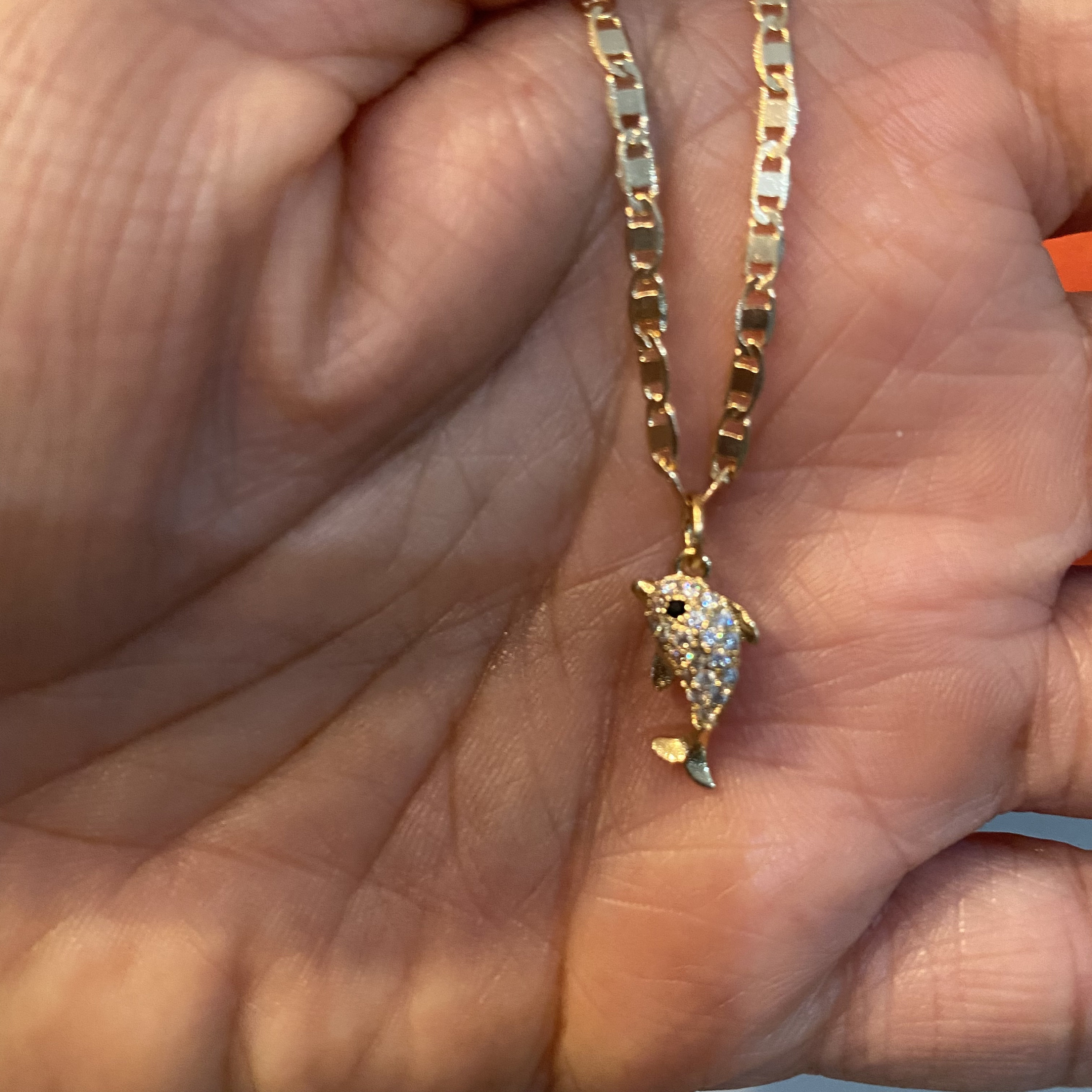 Wearing cheap fish pendant