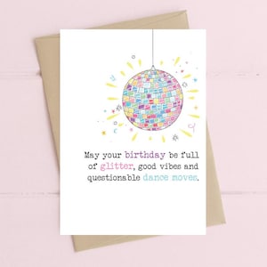 May include: A birthday card featuring a colourful disco ball illustration. The card reads: "May your birthday be full of glitter, good vibes and questionable dance moves."