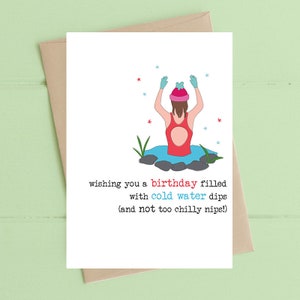 May include: A birthday card featuring a cartoon illustration of a person in a red swimsuit, a pink hat and blue gloves, standing in a pool of water with their arms raised. The text on the card reads: "wishing you a birthday filled with cold water dips (and not too chilly nips!)"