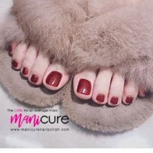 May include: Red nail polish stickers for toes. The stickers are in a square shape and are arranged in rows on a white background. The text "W108" is printed in the bottom right corner of the sheet.