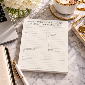 May include: A rectangular notepad with off-white paper featuring black printed text that reads Notes From Another Meeting That Could Have Been An Email, with sections for meeting topic, date, key points, action items, and follow-up tasks.