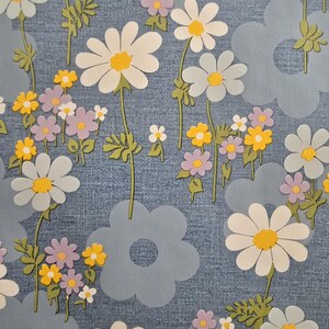 Gloss-coated retro floral fabric showing daisies and small flowers