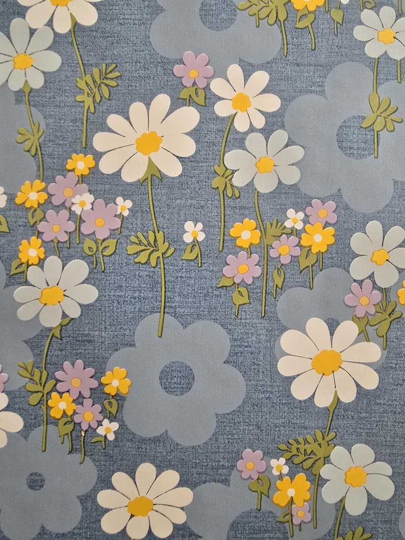 Gloss-coated retro floral fabric showing daisies and small flowers