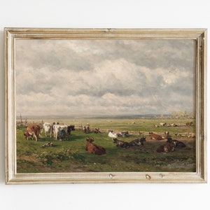 May include: A framed oil painting depicting a pastoral scene with a herd of cows grazing in a green field under a cloudy sky.