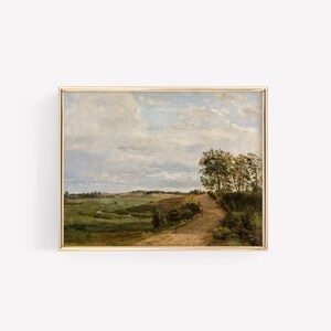 May include: A framed painting depicting a rural landscape with a winding dirt road leading through a field of green grass and trees. The sky is a light blue with fluffy white clouds.