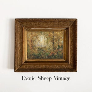 May include: A vintage framed painting of a forest scene with a golden frame. The painting depicts a forest with trees and foliage in shades of green, brown, and yellow. The frame has a decorative design with intricate details.
