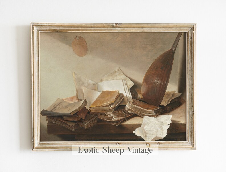 May include: A framed painting of a still life with a lute, books, and papers on a wooden table. The painting is in a light brown frame with a white mat.
