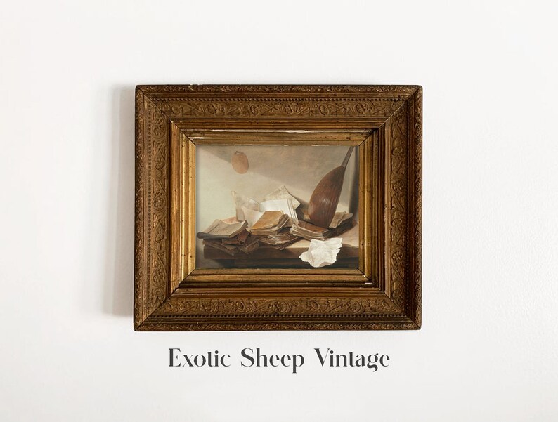 May include: A framed vintage still life painting of a lute, books, and papers in a gold frame.