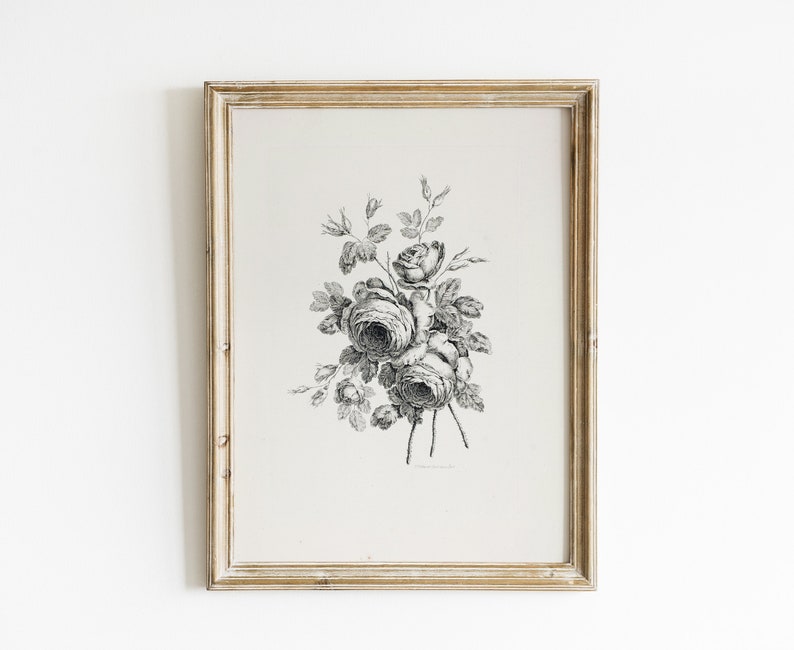 May include: A black and white vintage illustration of a bouquet of roses in a simple frame. The roses are drawn in a detailed style with delicate petals and leaves.