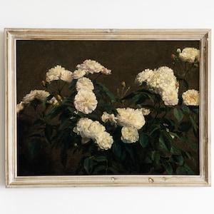 May include: A framed painting of white roses in bloom. The roses are depicted in a realistic style with delicate petals and green leaves. The background is a dark brown color, creating a contrast with the bright white flowers.