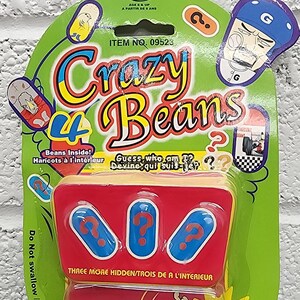 May include: A Crazy Beans game package with a green and red design. The package features the text "Crazy Beans" in large, colorful letters, along with the text "Beans Inside!" and "Guess who am I?". The package also includes the text "Try Me".