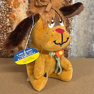 Dakin Dream pets Rufus dog