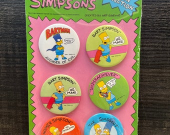May include: A set of six The Simpsons button pins. The pins feature Bart Simpson in various poses and sayings, including "Bartman, Avenger of Evil", "Yo Man!" and "Underachiever". There is also a pin featuring Homer Simpson with the saying "No Problemo!" and a pin featuring the entire Simpson family.