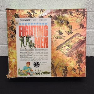 May include: Vintage "Fighting Men" toy set box featuring illustrations of soldiers and military vehicles. The box includes text that reads "Make Bendable Soldiers in Permanent Plastic!" and "40 Accessories!"