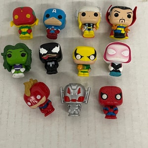 May include: A collection of 12 small plastic figurines of Marvel superheroes. The figurines are in various poses and include characters like Spider-Man, Iron Man, Captain America, Hulk, and Thor.