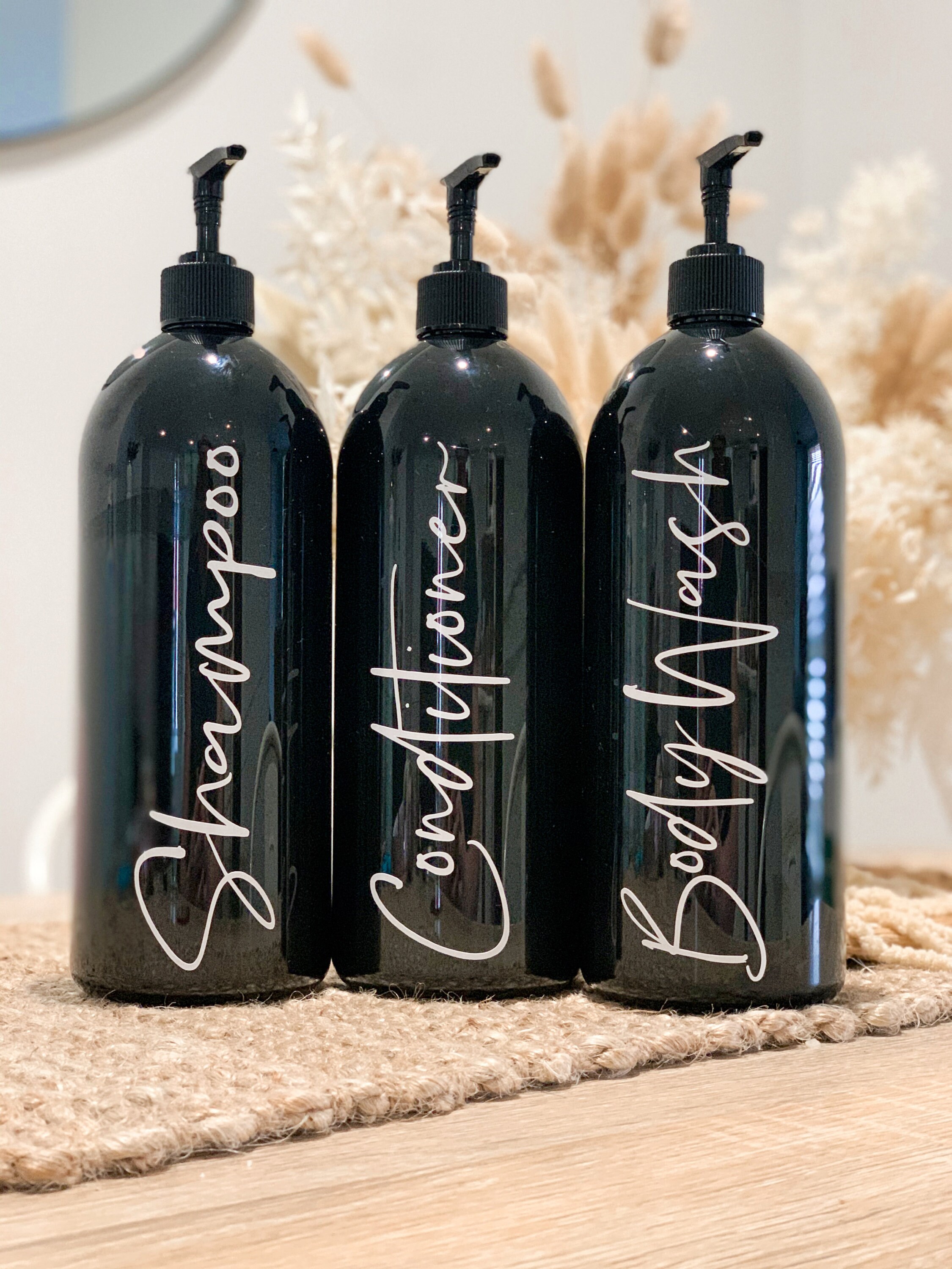 Set Of Black Shampoo, Conditioner And Body Wash Pump Bottles
