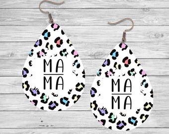 May include: A pair of teardrop-shaped earrings with a white background and a black and white leopard print pattern. The earrings have a colorful confetti-like pattern and the word "MAMA" written in black.