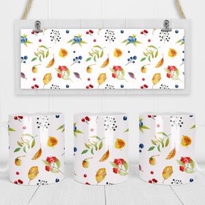 May include: Three white ceramic mugs with a fall-themed design. The mugs feature a repeating pattern of yellow leaves, red berries, blue berries, and green stems on a white background.