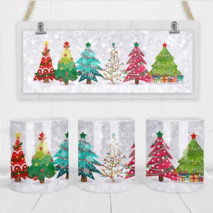 May include: Set of three white ceramic mugs with a winter holiday theme. Each mug features a row of five cartoon Christmas trees with different decorations, including red, green, blue, and gold ornaments, lights, and presents. The background of the mugs is a white and silver glitter pattern.