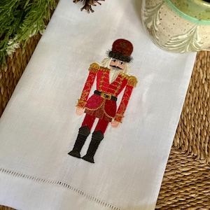 Embroidered Nutcracker Linen Towel: Red Holiday Decor