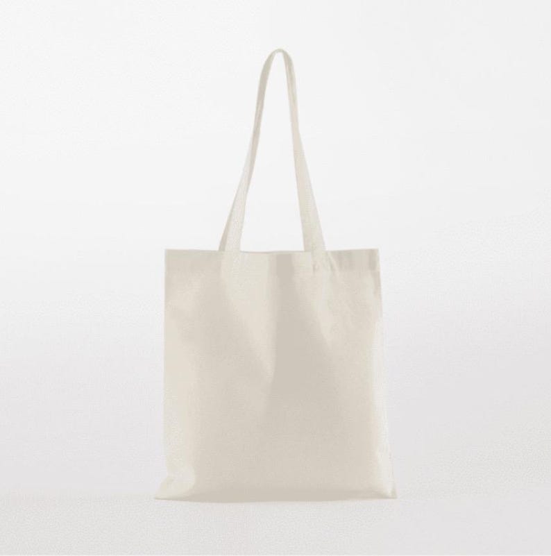 May include: A plain white tote bag with two long handles.