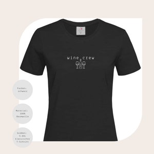May include: Black women's t-shirt with the text "wine crew" and a graphic of a wine bottle and three wine glasses.