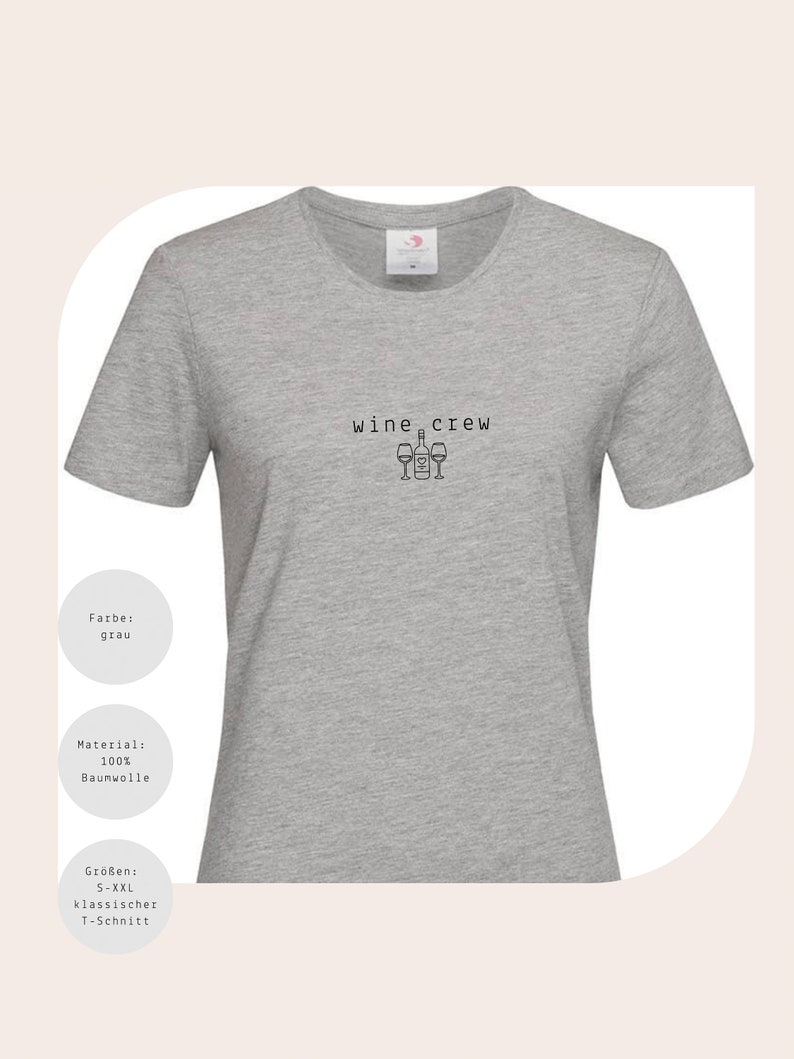 May include: Grey t-shirt with the text "wine crew" and a graphic of wine bottles and glasses.