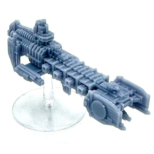 May include: A detailed grey miniature spaceship model. The model has a long, rectangular body with complex geometric structures, mounted on a clear, circular stand. The design suggests a science fiction or fantasy theme, with a focus on intricate detailing.