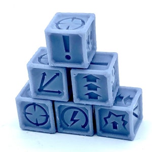 May include: A collection of seven light grey dice, each displaying a unique symbol on each face. Symbols include arrows, exclamation marks, and targets. The dice are stacked in a pyramid formation, with an exclamation mark on the top die.