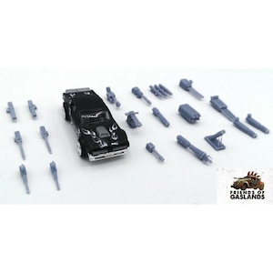 May include: A black toy car with silver flames on the bonnet, surrounded by various grey miniature weapon models. The car has silver wheels. The image includes the text "FRIENDS OF GASLANDS" and a graphic of a car.