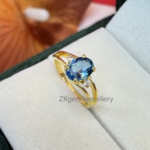 Oval Swiss Blue Topaz Ring: Sterling Silver, December Birthstone