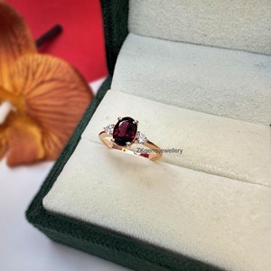 Oval Rhodolite Garnet Ring: Rose Gold Plated Sterling Silver, Zircon Accents