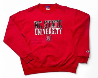 Sweat-shirt ras du cou vintage des années 90 Wolfpack Champion de l'État de Caroline du Nord