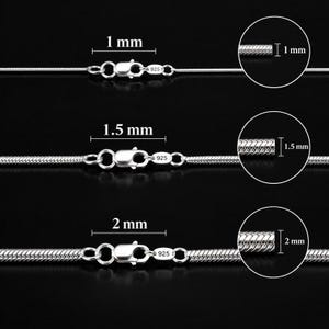 Puede incluir: Tres cadenas de serpiente de plata con cierres de langosta, cada una marcada con 925. Las cadenas tienen diámetros de 1 mm, 1,5 mm y 2 mm, como indican las etiquetas y las vistas de sección transversal circular en la imagen.