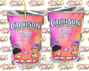 May include: A Capri Sun juice pouch with a pink and yellow background. The pouch has the text "Capri Sun" and "The Proud Family Gender Reveal" printed on it. The pouch features a cartoon boy and girl with the text "Boy - or - Girl" and "Who will baby be?" printed below.
