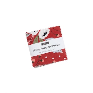 May include: A square stack of fabric squares with pinked edges, featuring a red background with white polka dots and floral patterns. A white paper band wraps around the center, printed with the text "christmas morning by Lella Boutique".