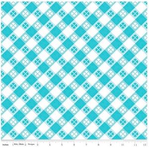 May include: A white and turquoise checkered fabric with a small four-leaf clover pattern. The fabric is perfect for crafting projects, quilting, and home decor.