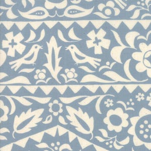 May include: A repeating pattern featuring white floral and bird motifs on a light blue background. The design includes stylized flowers, leaves, and birds, separated by geometric borders. The overall aesthetic is reminiscent of folk art.