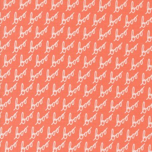 May include: A coral orange fabric with a white repeating pattern of the word "boo" written in a cursive font.